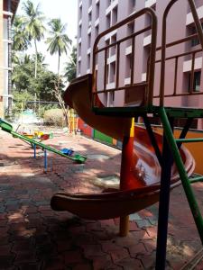 a park with a playground with a bench at Vrindavan Suites Guruvayur in Guruvāyūr