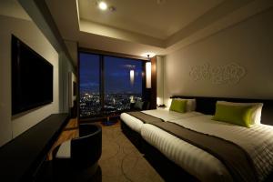 Postel nebo postele na pokoji v ubytování Futakotamagawa Excel Hotel Tokyu