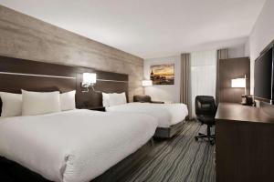 Postel nebo postele na pokoji v ubytování Days Inn by Wyndham Kingston + 27 fotografií