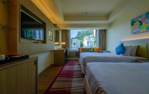 Mercure Penang Beach客房内的一张或多张床位