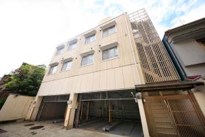 a white building with a lot of windows at Posada Suimei in Hakone