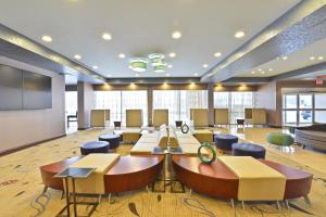 a conference room with a large table and chairs at Wyndham Garden Elk Grove Village - O'Hare in Elk Grove Village