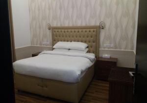 Postel nebo postele na pokoji v ubytování Royal Residence Hotel Apartments
