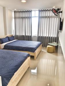 En eller flere senger på et rom på Hoang Vu Guest House