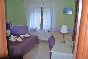 Postel nebo postele na pokoji v ubytování B&B L'Ancora