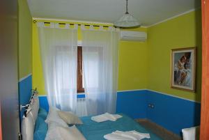 Postel nebo postele na pokoji v ubytování B&B L'Ancora