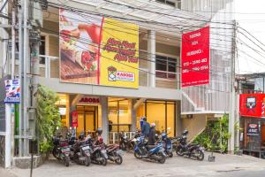 a group of motorcycles parked in front of a building at RedDoorz Plus @ Dipatiukur in Bandung