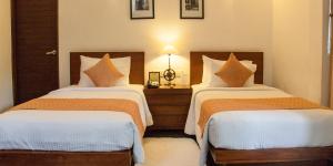 Voodi või voodid majutusasutuse Colombo Court Hotel & Spa toas