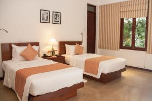 Voodi või voodid majutusasutuse Colombo Court Hotel & Spa toas
