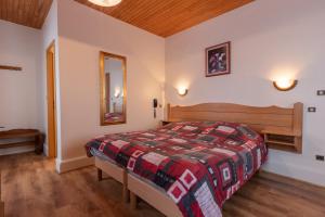 Ένα ή περισσότερα κρεβάτια σε δωμάτιο στο Relais du Klevener