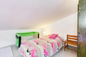 Łóżko lub łóżka w pokoju w obiekcie Le Tamerici