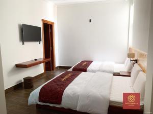 Voodi või voodid majutusasutuse Bảo Thịnh 2 Hotel toas