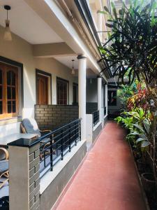 a corridor of a building with plants and a walkway at Leisure Cottages in Baga