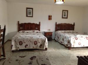 Postel nebo postele na pokoji v ubytování Hotel Atilanos