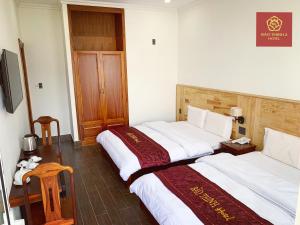 Voodi või voodid majutusasutuse Bảo Thịnh 2 Hotel toas