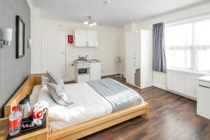 Postel nebo postele na pokoji v ubytování Flexistay Tulsi Aparthotel + 25 fotografií