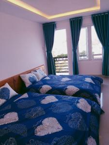Postel nebo postele na pokoji v ubytování Ha Khoa Hotel Dalat