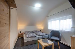 Postel nebo postele na pokoji v ubytování Penzion Hády