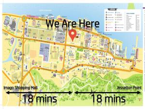 a map with a red arrow and a map at Signel Hostel in Kota Kinabalu