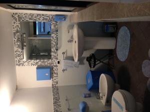 a small bathroom with a sink and a mirror at B&B La Terrazza Sul Mare Taormina in Taormina