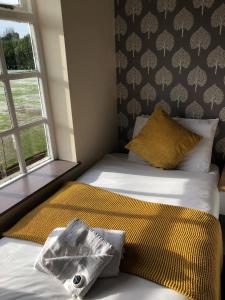 Posteľ alebo postele v izbe v ubytovaní Minworth Lodge