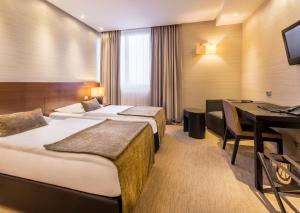 Postel nebo postele na pokoji v ubytování Hotel Residence