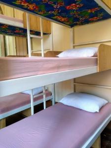 a group of bunk beds in a room at Lapa Casa Hostel in Rio de Janeiro