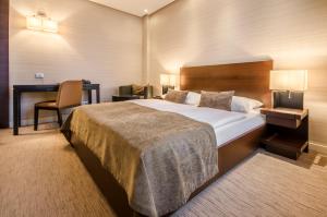 Postel nebo postele na pokoji v ubytování Hotel Residence