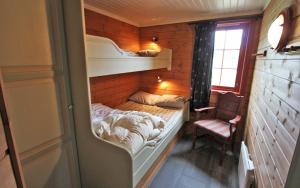 Postel nebo postele na pokoji v ubytování Sjumilskogen