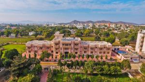 an aerial view of a large building with trees at Hotel Pushkar Legacy in Pushkar