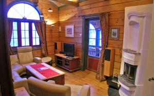 TV a/nebo společenská místnost v ubytování Sjumilskogen