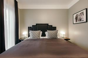 Łóżko lub łóżka w pokoju w obiekcie Hotel Borg by Keahotels