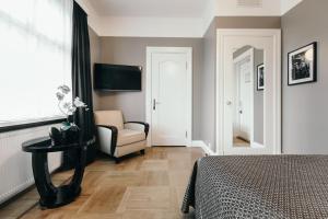 Telewizja i/lub zestaw kina domowego w obiekcie Hotel Borg by Keahotels