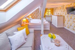 a living room with a couch and two beds at Chata Pogaduchy in Ronin