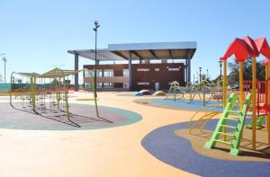 an empty playground with slides and a play structure at Departamento Moritan in Posadas