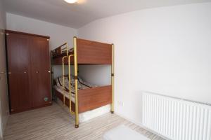 a bedroom with two bunk beds and a closet at Sarajevo Apartments in Sarajevo