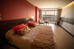 Postel nebo postele na pokoji v ubytování Hotel Estilo MB - Villa Carlos Paz