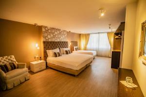 Ένα ή περισσότερα κρεβάτια σε δωμάτιο στο Hotel Boutique El Triángulo