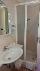 a bathroom with a sink and a shower at Tenuta Di Pietra Porzia in Frascati