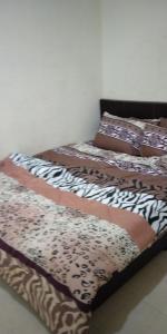 Postel nebo postele na pokoji v ubytování Homestay Simple