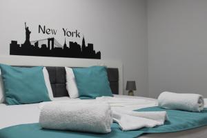 Postel nebo postele na pokoji v ubytování Hotel New York