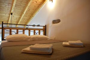 A bed or beds in a room at Christos Raches traditional houses