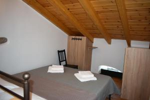 A bed or beds in a room at Christos Raches traditional houses