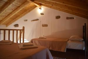 A bed or beds in a room at Christos Raches traditional houses
