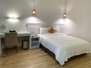 Postel nebo postele na pokoji v ubytování Joy Hotel