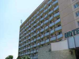 a hotel with a sign on the side of it at Hotel Traian Eforie Nord in Eforie Nord +13 photos