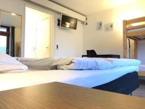 En eller flere senge i et værelse på Hotel Aulum Kro
