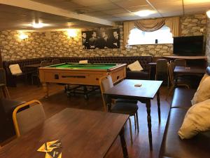 a bar with a pool table in a room at North Parade Seafront Accommodation in Skegness