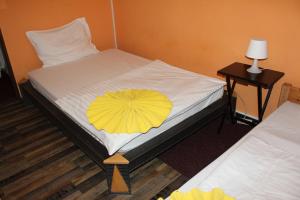 Postel nebo postele na pokoji v ubytování Hotel Praha Club bed & breakfast