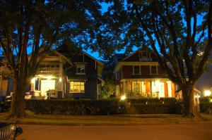 a house with its lights on at night at Douglas Guest House in Vancouver